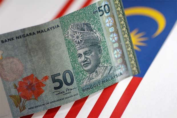 Foreign banks shaken by Malaysia's move to halt currency slide | Reuters