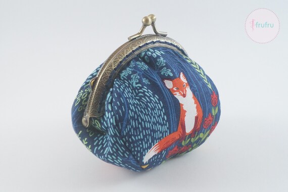 Maruca’s fabric coin purse, wallets, and cosmetic bags in artsy patterns.