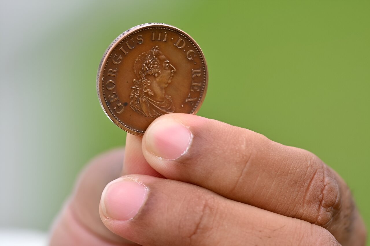 Probability of a tossed coin landing on edge